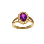 Anello oro giallo con zirconi bianchi e pietra centrale viola
