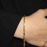 Bracciale due ori catena ovale piatta baraka