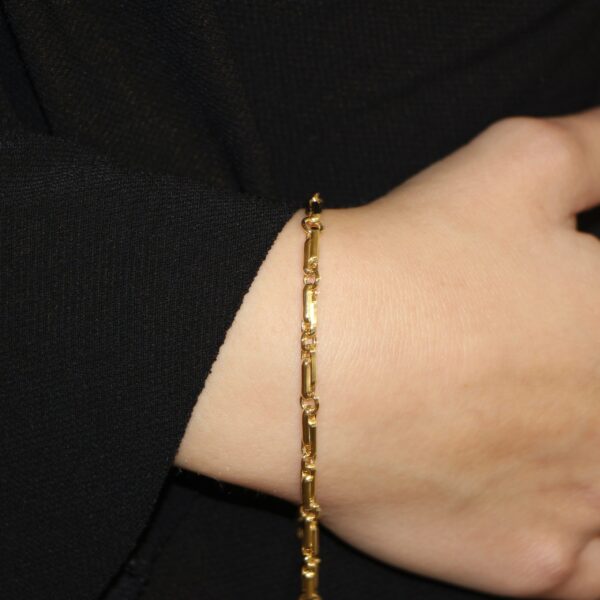 Bracciale due ori catena ovale piatta baraka