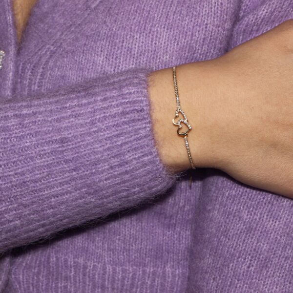 Bracciale oro giallo rigido con cuore centrale e zirconi bianchi