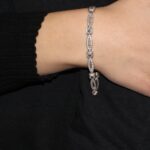 Bracciale oro bianco semirigido con zirconi