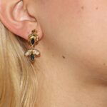 Orecchini oro giallo pendenti con zirconi blu