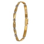 BRACCIALE DUE ORI FASCIETTE SEMIRIGIDO CON FIOCCHI CENTRALI