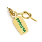 Marlù charm dorato con scritta "NONNO" e nodo catena snake