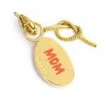 Marlù charm dorato con scritta "MAMMA" e dettaglio nodo snake