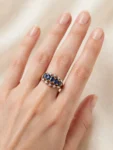 ANELLO ORO GIALLO 375 CON  ZAFF BLU TAGLIO OVALE  KT 0.60 E DIAMANTI KT 0.25+0.02 H/I VS