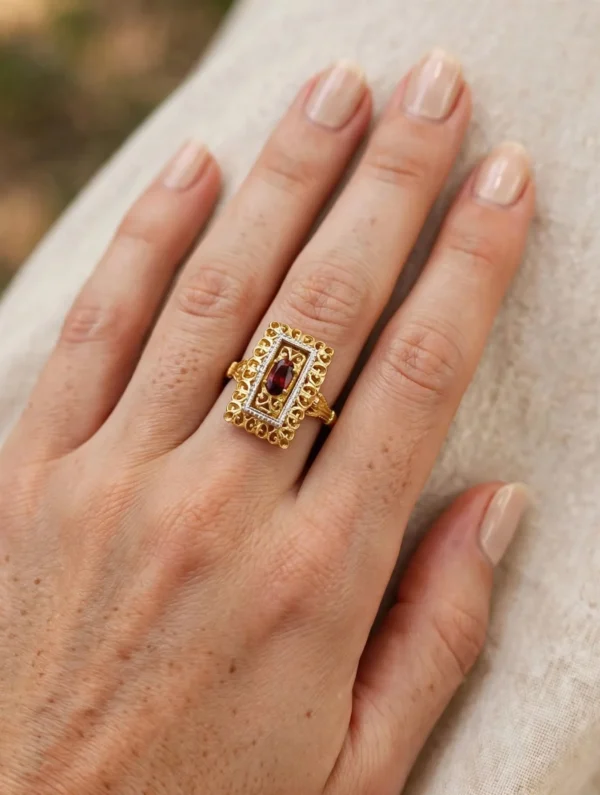 ANELLO DUE ORI CON ZIRCONE ROSSO