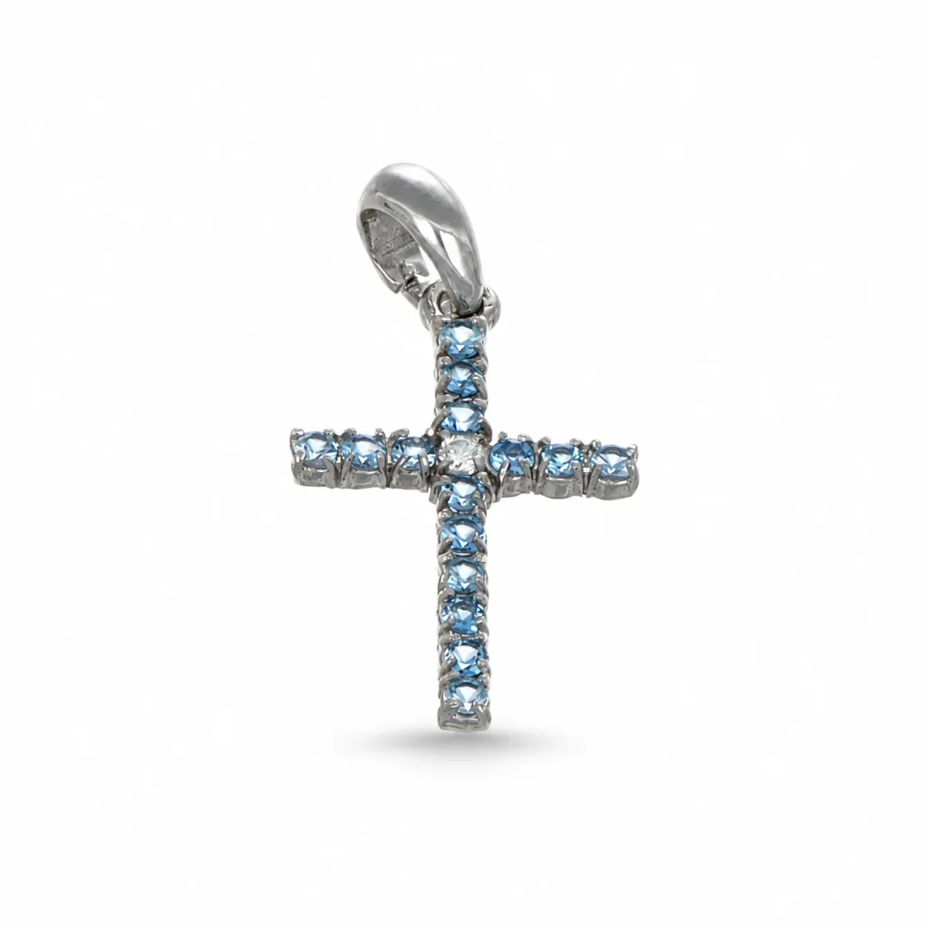 Croce in oro bianco 18 kt con zirconi azzurri disposti lungo i bracci