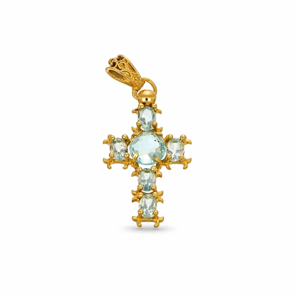 Croce in oro giallo 18 kt con zirconi celesti e pietra centrale ovale
